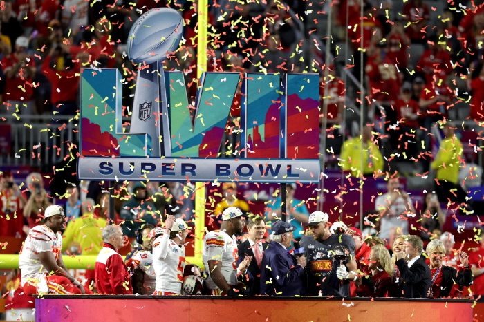 Travis Kelce #87 of the Kansas City Chiefs celebrates with the the Vince Lombardi Trophy after defeating the Philadelphia Eagles 38-35 in Super Bowl LVII at State Farm Stadium on February 12, 2023, in Glendale, Arizona.